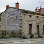 Old Building with Painted Advertisement near Bordeaux France Photo by Sebastian Motsch