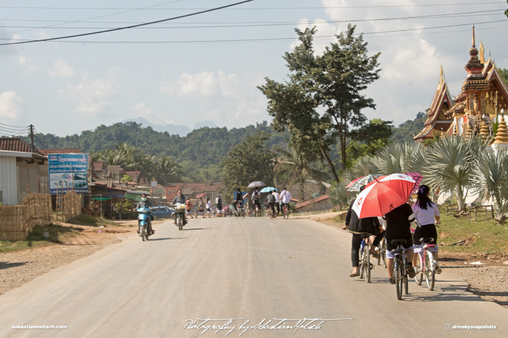 Cycling in Laos on Mountain Road 13 Drive-by Snapshots by Sebastian Motsch