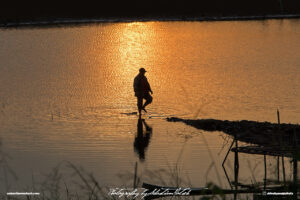 Laos Vientiane Mekong River Sunset Fisherman Travel Photography by Sebastian Motsch