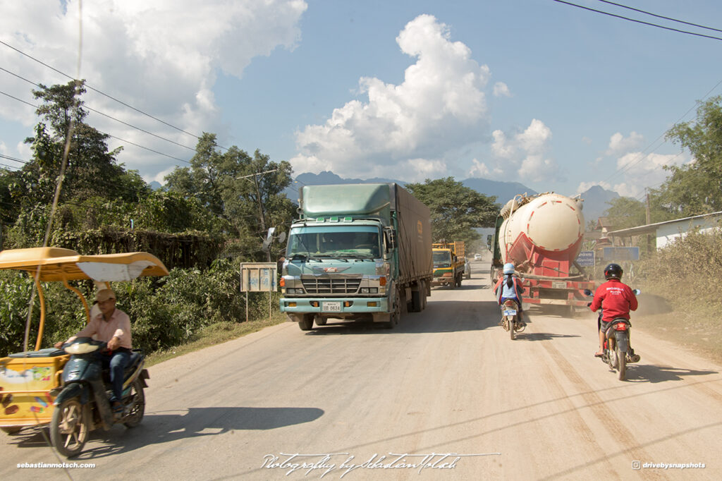 Motorcycle Sidecar and Hino Truck in Laos on Mountain Road 13 Drive-by Snapshots by Sebastian Motsch