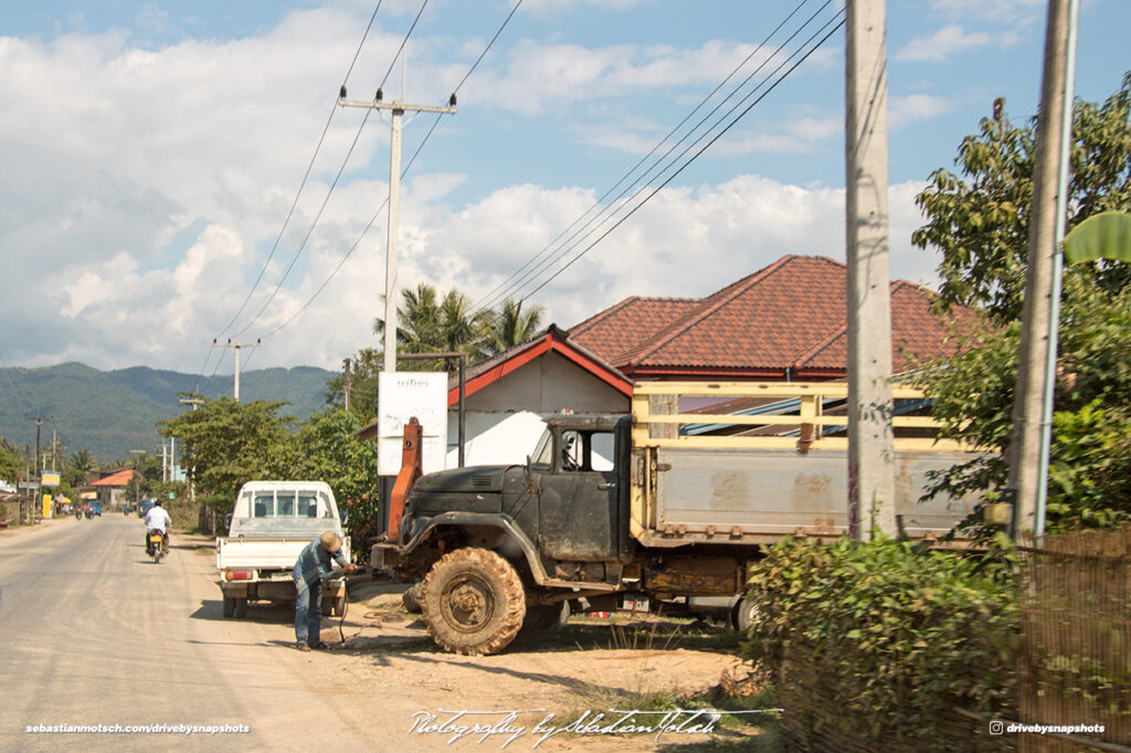 Roadside Truck Repairs on Road 13 Laos Drive-by Snapshot by Sebastian Motsch