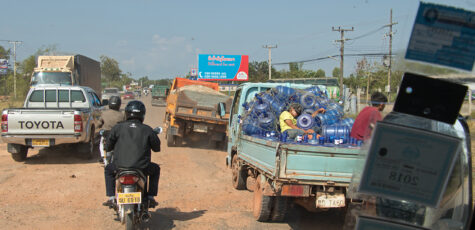 Street Scene with Trucks and Scooters Laos Drive-by Snapshots by Sebastian Motsch
