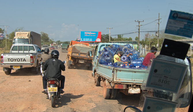 Street Scene with Trucks and Scooters Laos Drive-by Snapshots by Sebastian Motsch