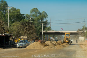 Toyota Hilux and Caterpillar at Roadworks in Laos Vientiane Drive-by Snapshot by Sebastian Motsch