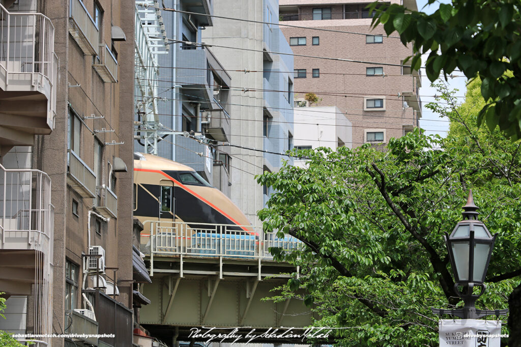 Japan Tokyo Asakusa Tobu Isesaki Line Train exiting Building by Sebastian Motsch