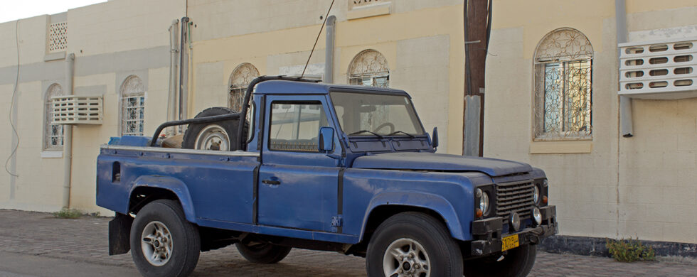 Land Rover Defender LWB Pick-up Oman Muscat Drive-by Snapshot by Sebastian Motsch front