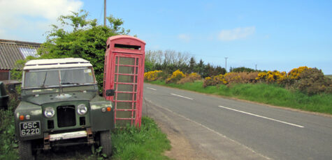 Land Rover Series II SWB Scotland with Red Telephone Booth Drive-by Snapshot by Sebastian Motsch