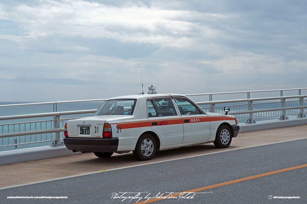 Toyota Crown Taxi parked on Irabu Ohashi Miyako-jima Japan by Sebastian Motsch