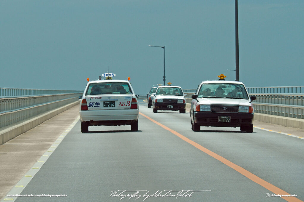 Toyota Crown Taxis driving on Irabu Ohashi Miyako-jima Japan by Sebastian Motsch