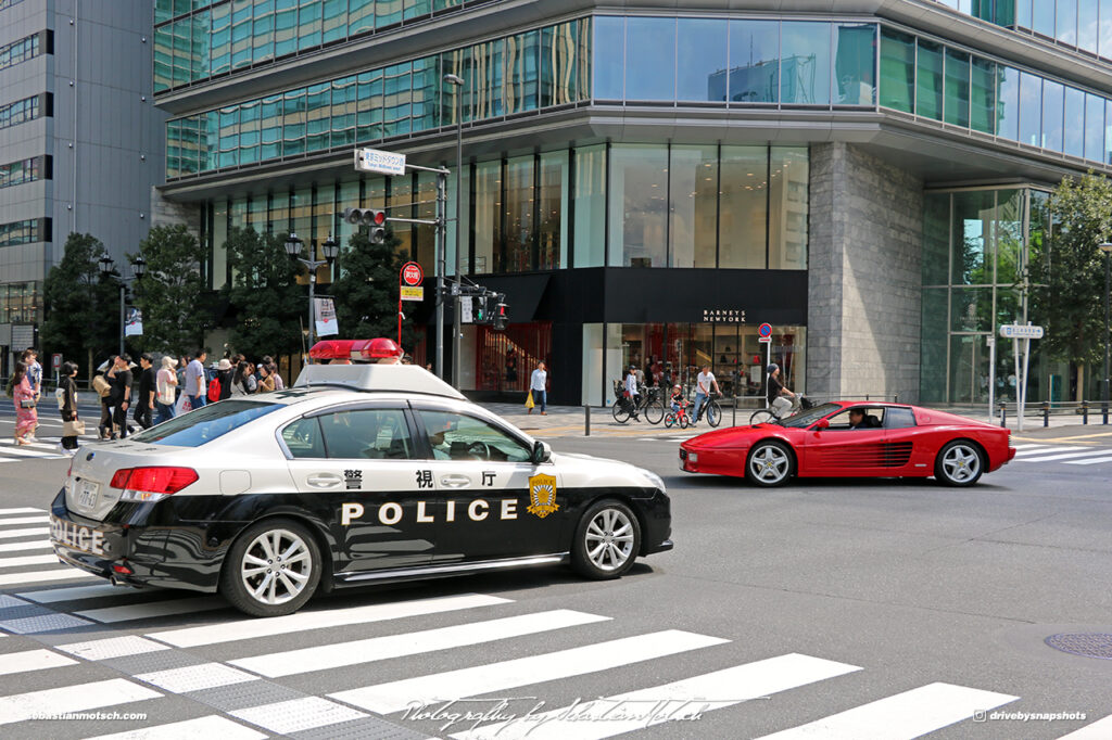 Japan Tokyo Roppongi Ferrari 512TR and Subaru Legacy Police Car by Sebastian Motsch