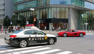 Japan Tokyo Roppongi Ferrari 512TR and Subaru Legacy Police Car by Sebastian Motsch