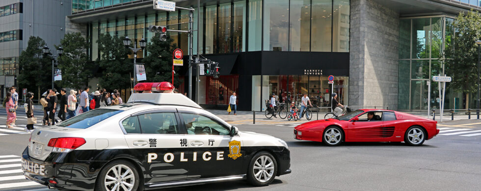 Japan Tokyo Roppongi Ferrari 512TR and Subaru Legacy Police Car by Sebastian Motsch