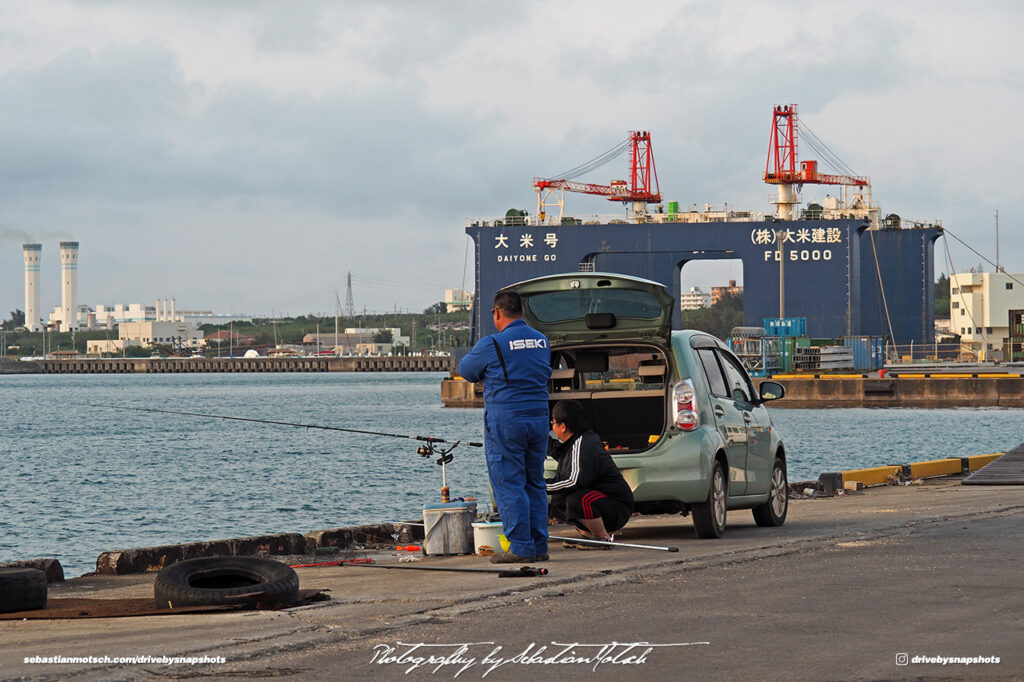 Two men fishing at Miyako-jima harbor Drive-by Snapshots by Sebastian Motsch