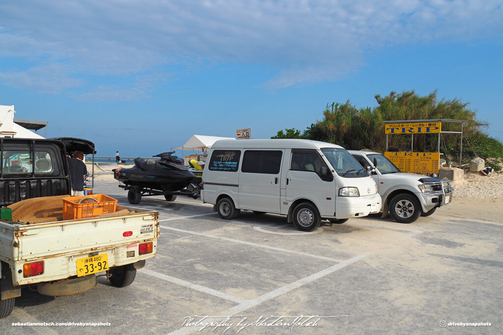 Daihatsu Hijet and Mazda Bongo at Yonaha Maehama Beach Miyako-jima by Sebastian Motsch