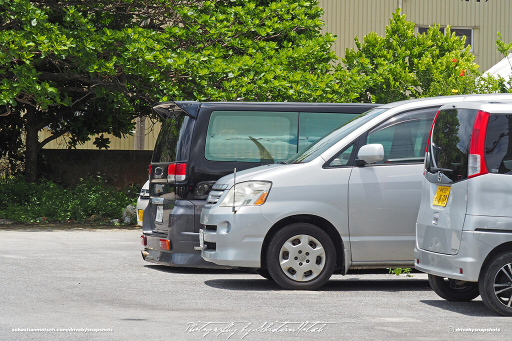 Vans parked at Yonaha Maehama Beach Miyako-jima by Sebastian Motsch