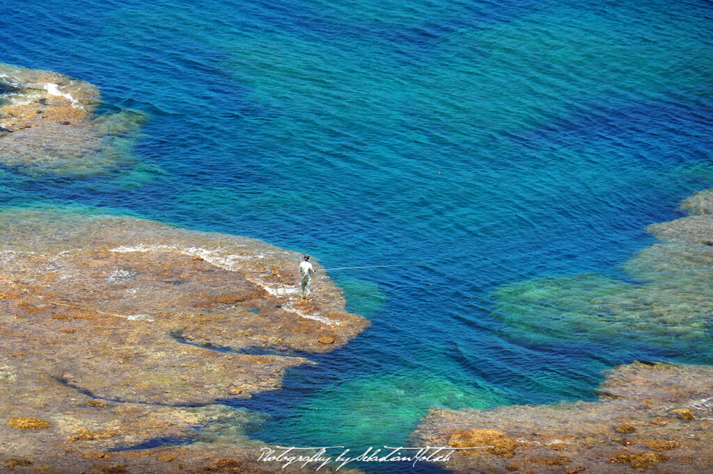 Yoshino Coastline Fisherman Miyako-jima Japan by Sebastian Motsch